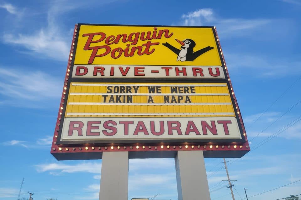 Penguin Point's sign in Warsaw during Sign Wars 2022