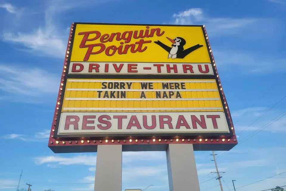 Penguin Point's sign in Warsaw during Sign Wars 2022